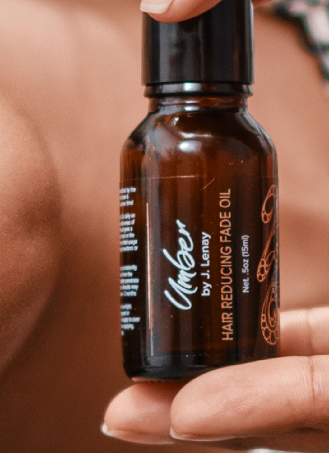 Held by model Hair Reducing Fade Oil