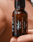 Held by model Hair Reducing Fade Oil