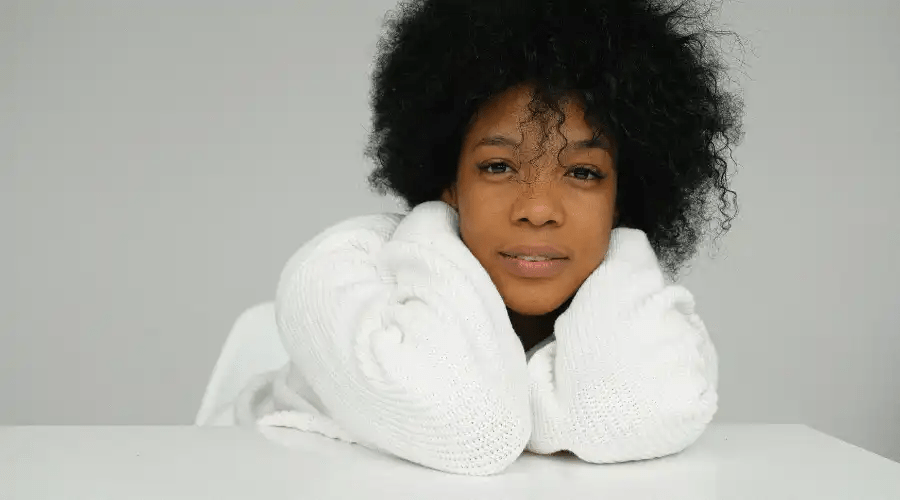 Frizzy afro hair lady in robe with smile