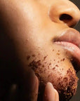woman applying Homemade Facial Sugar Scrub to her chin
