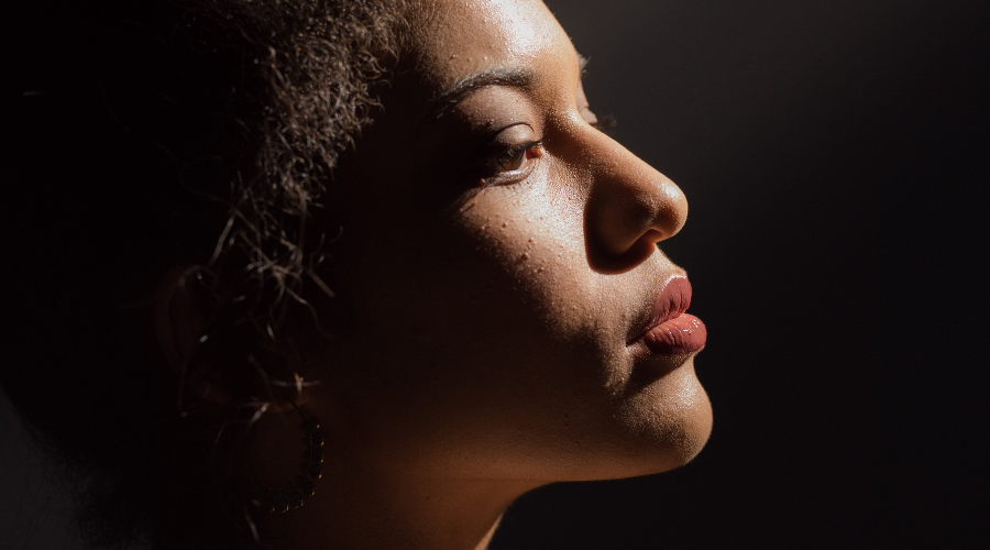 African American woman with chin tilted forward